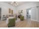 Stylish living room features light wood floors, contemporary decor, an open layout, and abundant natural light at 3811 N Arlington Ave, Tampa, FL 33603