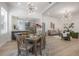 Bright open-concept living and dining area with modern lighting and stylish decor at 3811 N Arlington Ave, Tampa, FL 33603