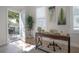Home office featuring bright light, modern desk, and view to an outdoor patio at 3811 N Arlington Ave, Tampa, FL 33603