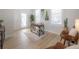 Bright home office with modern desk, neutral rug, and natural light from large windows at 3811 N Arlington Ave, Tampa, FL 33603