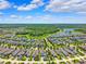 Beautiful neighborhood featuring mature trees, tranquil lakes, and well-maintained homes at 3833 Villamore Ln, Odessa, FL 33556