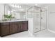 Modern bathroom featuring a glass-enclosed shower and granite countertop vanity at 3833 Villamore Ln, Odessa, FL 33556