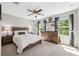 Charming bedroom featuring a wood-framed bed and natural light at 3833 Villamore Ln, Odessa, FL 33556