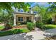 Charming two-story home with a welcoming front porch and well-manicured landscaping at 3833 Villamore Ln, Odessa, FL 33556