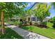 Charming two-story home with a inviting yard, beautiful landscaping, and walkway at 3833 Villamore Ln, Odessa, FL 33556