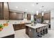 Modern kitchen with stainless appliances, granite counters, a gas cooktop, and barstool seating at 3833 Villamore Ln, Odessa, FL 33556