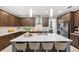 Spacious kitchen island with seating and stainless steel appliances at 3833 Villamore Ln, Odessa, FL 33556