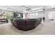 Expansive living room boasting an entertainment center, plush sofa, and ample space at 3833 Villamore Ln, Odessa, FL 33556