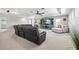 Large living room with a home theatre setup, plush sofa, and modern finishes at 3833 Villamore Ln, Odessa, FL 33556