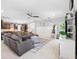 Open concept living room with view of kitchen, stylish furnishings, and plenty of natural light at 3833 Villamore Ln, Odessa, FL 33556