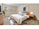 Bedroom featuring a window, bright natural light, neutral wall colors, and stylish decor at 3918 Silverlake Way, Wesley Chapel, FL 33544