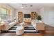 Cozy living room with a modern design, comfortable seating, bookshelves, and a TV at 3918 Silverlake Way, Wesley Chapel, FL 33544
