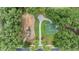 Aerial view of a community playground with a basketball court and seating area at 3918 Silverlake Way, Wesley Chapel, FL 33544