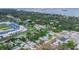 Explore this home near the baseball field, lush trees, and walkable neighborhood streets at 411 Locklie St, Dunedin, FL 34698