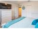 Bright main bedroom with ensuite and large dresser at 411 Locklie St, Dunedin, FL 34698