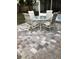Enjoy outdoor dining on this patio with pavers, patio table, four chairs, and backyard views at 411 Locklie St, Dunedin, FL 34698