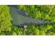 Aerial view of dock surrounded by lush trees and waterways at 4322 Fincastle Ct, Tampa, FL 33624