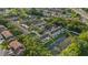 Aerial view features townhomes nestled beside a tranquil pond and mature trees in a quiet neighborhood at 4322 Fincastle Ct, Tampa, FL 33624