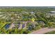 Wide aerial shot of townhomes in a neighborhood with a pond surrounded by lush vegetation at 4322 Fincastle Ct, Tampa, FL 33624