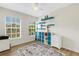 Bedroom with natural light, blue shelves and a ceiling fan at 4322 Fincastle Ct, Tampa, FL 33624