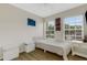 Bright bedroom with light walls, wood floors and sun-filled windows at 4322 Fincastle Ct, Tampa, FL 33624