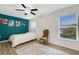 Stylish bedroom with a teal accent wall and modern decor at 4322 Fincastle Ct, Tampa, FL 33624