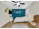 Well-lit bedroom with a ceiling fan, hardwood floors, and natural light at 4322 Fincastle Ct, Tampa, FL 33624