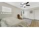 Bright bedroom featuring hardwood floors, dual closets, and natural lighting at 4322 Fincastle Ct, Tampa, FL 33624