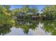 Scenic view of the dock from the water in a lush location at 4322 Fincastle Ct, Tampa, FL 33624