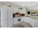 Well-lit kitchen features white cabinets, granite counters, stainless appliances, and a tiled backsplash at 4322 Fincastle Ct, Tampa, FL 33624