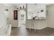 Open kitchen view with a breakfast bar, granite countertops, and white cabinetry at 4322 Fincastle Ct, Tampa, FL 33624