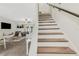 Inviting living room featuring staircase, tile floors, and natural light at 4322 Fincastle Ct, Tampa, FL 33624