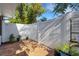 Private brick patio with white fencing, offering a serene outdoor space at 4322 Fincastle Ct, Tampa, FL 33624