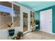Bright sunroom featuring tiled floors, and abundant natural light filtering through numerous windows and doors at 4322 Fincastle Ct, Tampa, FL 33624