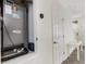 Image displays a utility closet featuring a Lennox HVAC system alongside a clean, white interior door at 4322 Fincastle Ct, Tampa, FL 33624