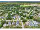 Scenic aerial view of homes nestled among lush trees in a well-established neighborhood at 4401 S Trask St, Tampa, FL 33611