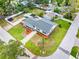 Aerial view of the home showcasing the well-maintained lawn, landscaping, roof, and location within the neighborhood at 4401 S Trask St, Tampa, FL 33611
