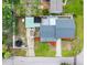 Aerial view of property highlighting the roof, back yard with boat and trampoline, and proximity to other properties at 4401 S Trask St, Tampa, FL 33611