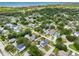 Scenic view of a quiet residential area, showcasing well-maintained homes nestled among mature trees and green lawns near the bay at 4401 S Trask St, Tampa, FL 33611