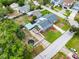 Aerial view of the home, showcasing the roof, backyard with boat storage, and neighborhood with tree coverage at 4401 S Trask St, Tampa, FL 33611