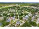 Overhead view of a peaceful residential area with well-spaced homes, verdant trees, and convenient street access at 4401 S Trask St, Tampa, FL 33611