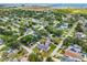 Serene aerial shot of a residential community with tidy homes and greenery, nestled near a playground and mature trees at 4401 S Trask St, Tampa, FL 33611