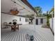 Inviting back porch with string lights and wood flooring offers a perfect outdoor retreat at 4401 S Trask St, Tampa, FL 33611