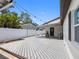Backyard deck features string lights, plenty of space for seating, and room for activities at 4401 S Trask St, Tampa, FL 33611