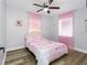 Bedroom with bed and pink curtains at 4401 S Trask St, Tampa, FL 33611