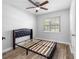 Bedroom with a bed frame and wood floors at 4401 S Trask St, Tampa, FL 33611