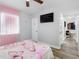 Bedroom with bed and pink curtains at 4401 S Trask St, Tampa, FL 33611
