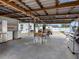 Large garage space with partial kitchen and seating provides extra workshop and entertaining areas at 4401 S Trask St, Tampa, FL 33611