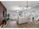 Spacious living room with modern columns, entertainment center and a comfortable sectional sofa at 4401 S Trask St, Tampa, FL 33611