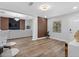 Bright and airy living room with stylish wall accents, neutral colors, and new laminate flooring at 4401 S Trask St, Tampa, FL 33611